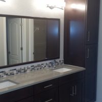 master bathroom remodel with his and her sinks and mirror