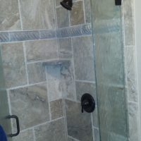 walk in shower with stone tile walls in Colorado Springs